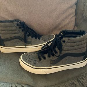Gray and black high top Vans